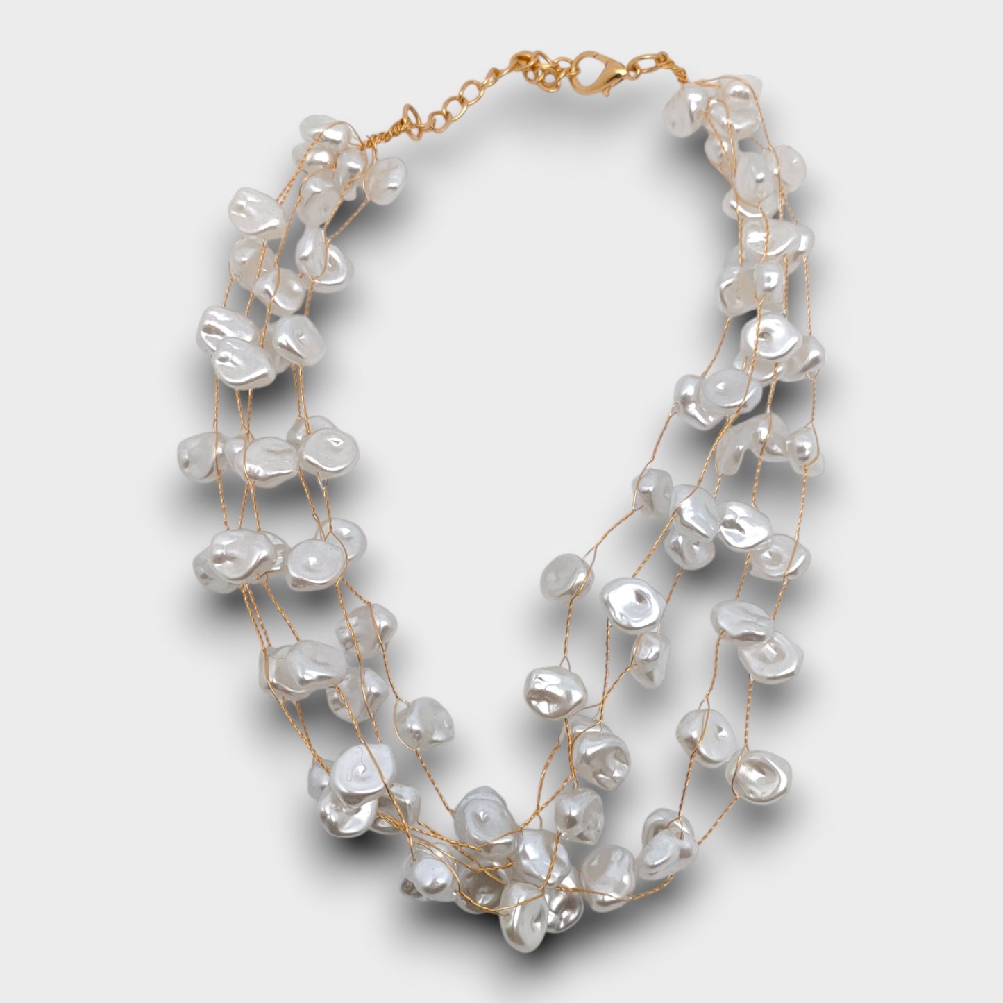 Collana "Perla Libera" – fili trasparenti con perle irregolari