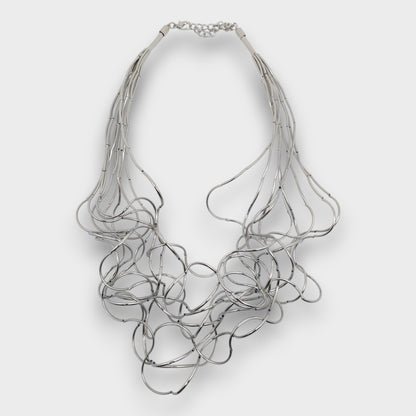 Collana "Onda Scultorea" – fili metallici intrecciati, finitura oro/argento